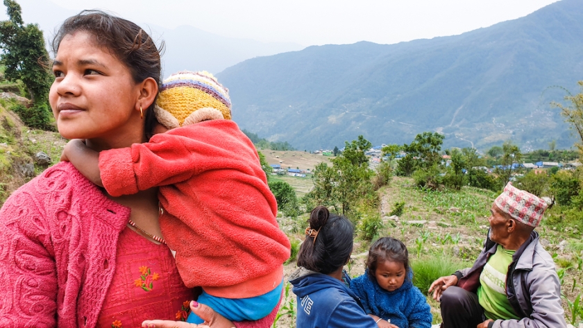 A woman holding her baby.