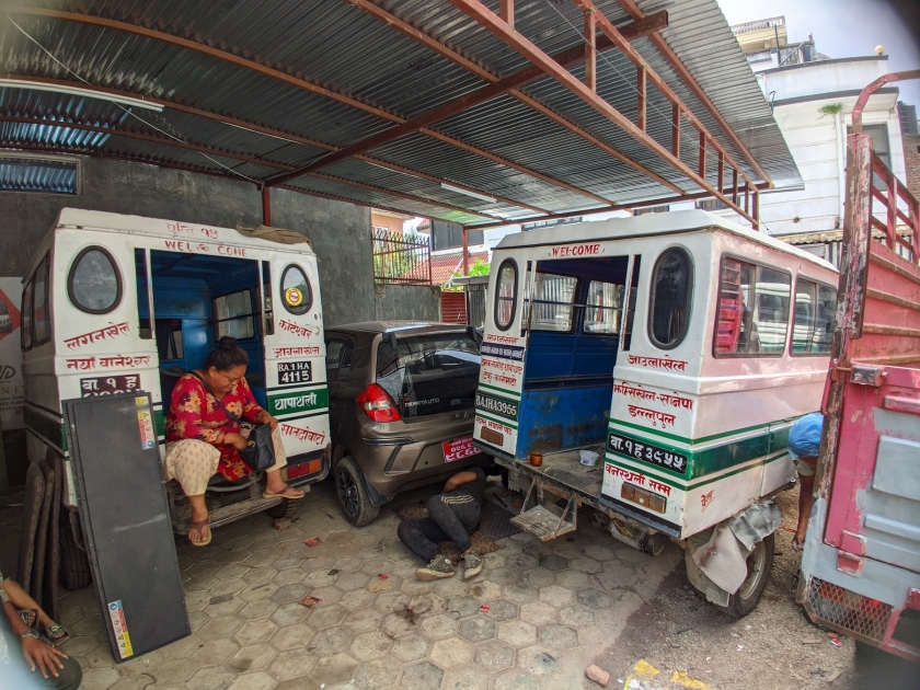 Electric buses are parked inside a garage in Kathmandu, Nepal.