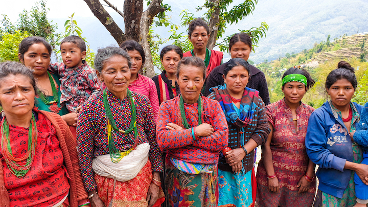 Women standing together looking at the camera